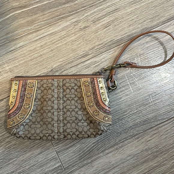 Coach Handbags - Coach Wristlet. Brown color